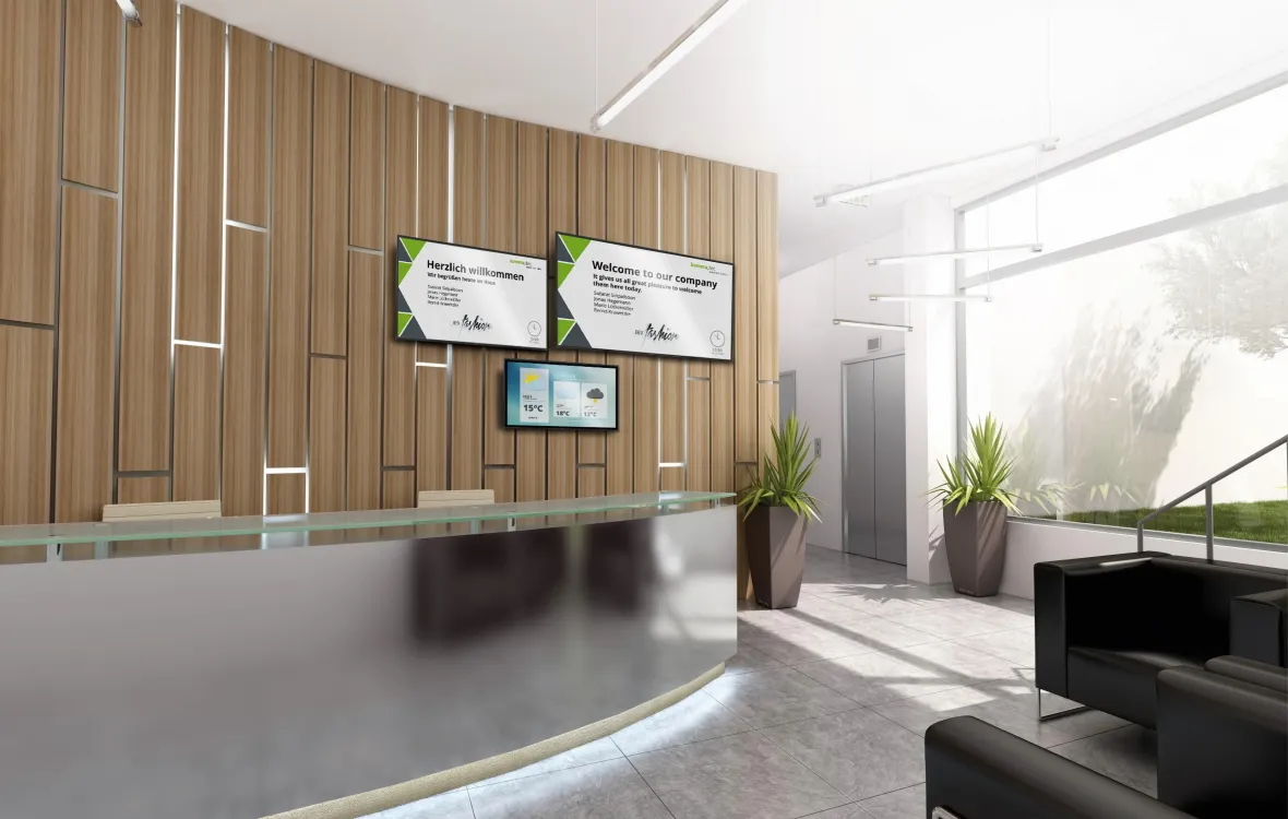Ein Empfangsmonitor begrüßt und informiert Kunden im Eingangsbereich